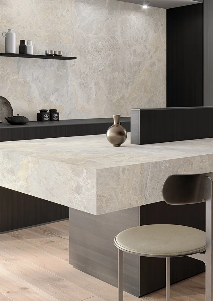 Marble-effect porcelain stoneware kitchen island with dark wood and brass details