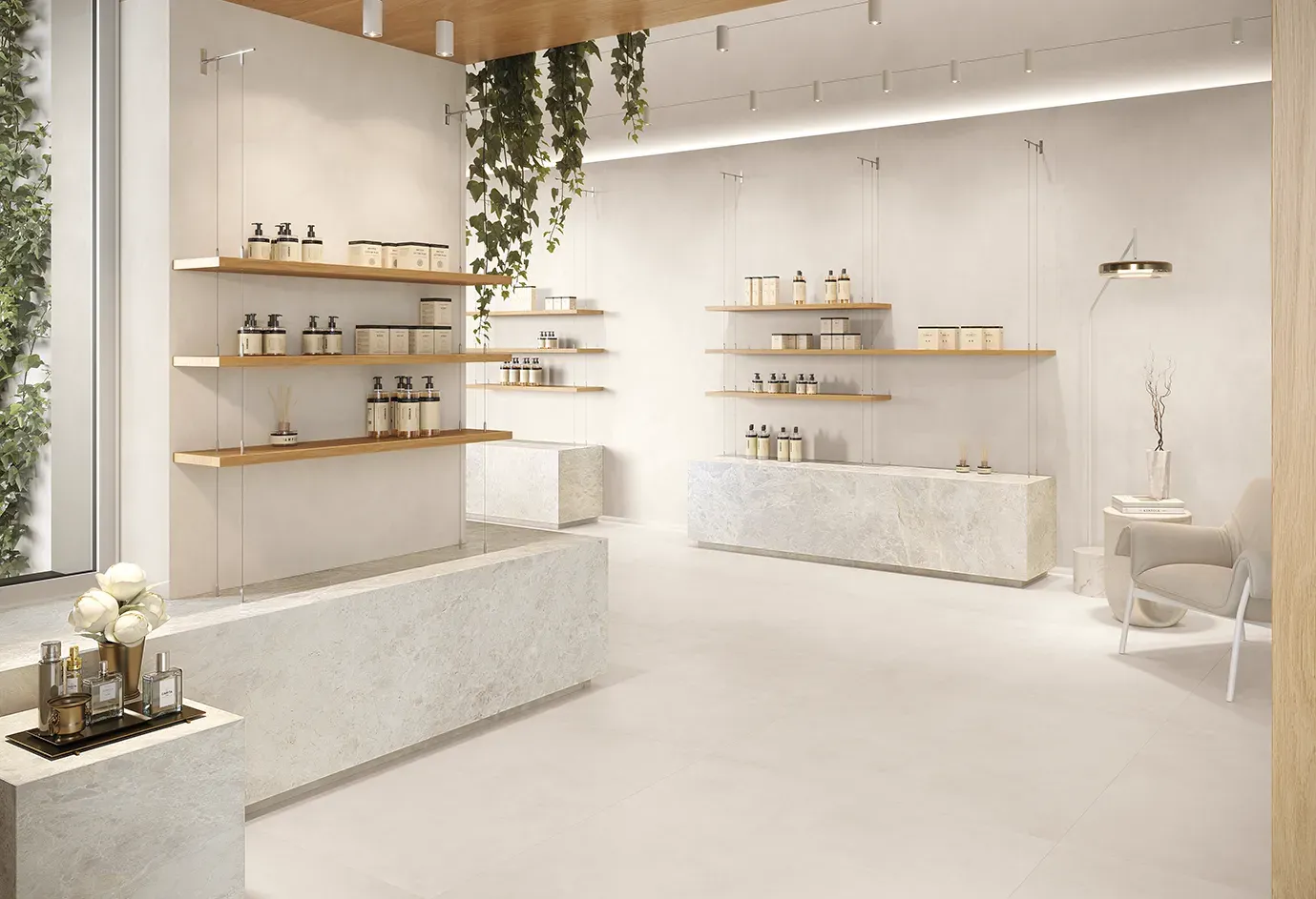 Interno boutique con piastrelle in gres porcellanato bianco effetto cemento su pavimento e bancone espositivo