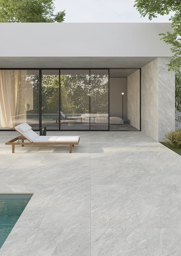 Silver marble-effect porcelain pavers on outdoor patio flooring with pool